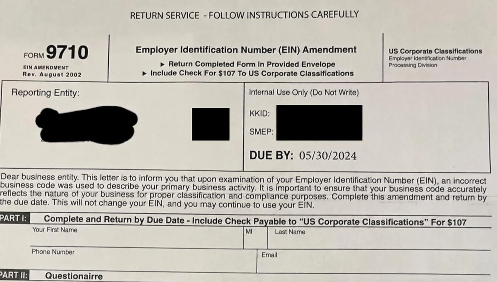 Public photograph of a fake Form 9710 EIN-amendment demand for $107, with recipient and tracking details redacted.